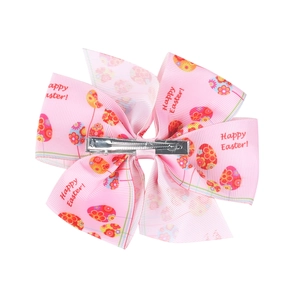 Detail of metal alligator clip on the back of a pink Easter ribbon bow hair clip
