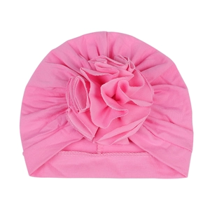 Pink cotton newborn turban hat with a large 3D fabric flower for babies 0-6 months