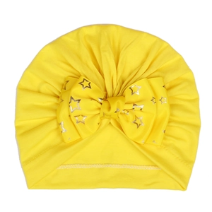 Infant yellow turban hat with large gold star printed bow in soft knit fabric