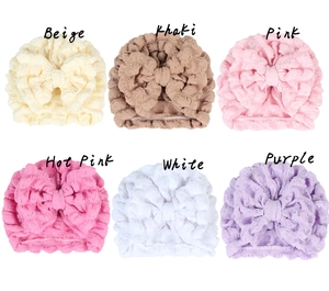 Detailed grid of six bubble texture baby turbans with oversized decorative bows