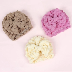 Set of 3 baby turban hats in brown, pink, and beige with soft bubble texture and large bows
