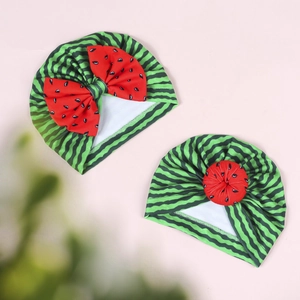 Detail of two-piece baby watermelon turbans with bow and knot design in soft knit fabric