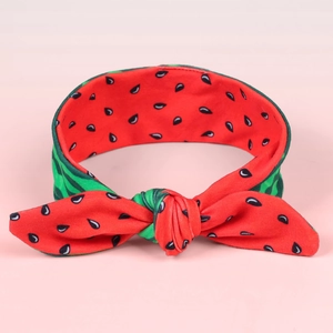 Elastic watermelon pattern baby headband with a cute bow knot on a pink background