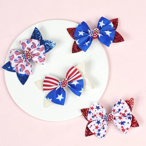 Detail of USA Independence Day bow hair clips with stars stripes and heart rhinestones