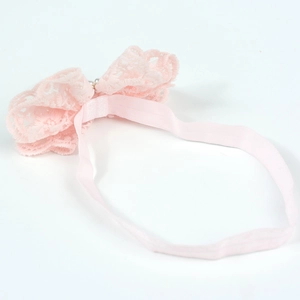 Bandeau bébé en dentelle rose avec nœud, perle centrale et maille extensible