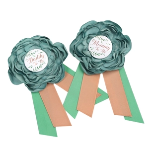 Green Mommy to Be and Daddy to Be floral badge set for baby shower parties