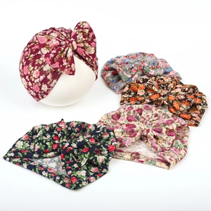 Set of five floral baby turbans with oversized bows on a clean white background