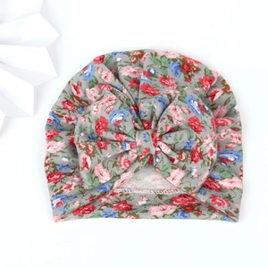 Floral baby turban hat with a large bow detail on a soft grey floral stretch fabric