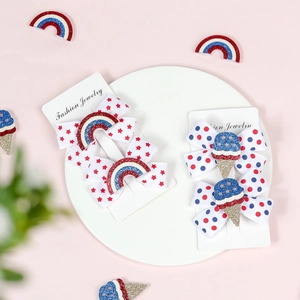 Detail of children's Independence Day bows with stars, dots, rainbow and ice cream clips