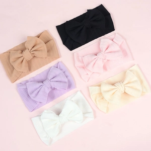 6-pack newborn elastic headbands with large bows in soft ribbed knit fabric
