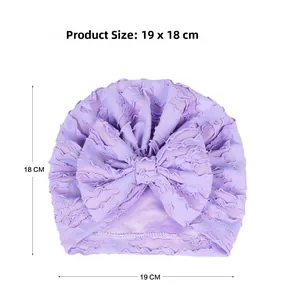 Detailed size specifications for purple infant turban hat with decorative bow detail
