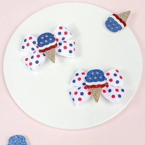 Detail of US Independence Day kids hair clips with red blue polka dots and ice cream decor