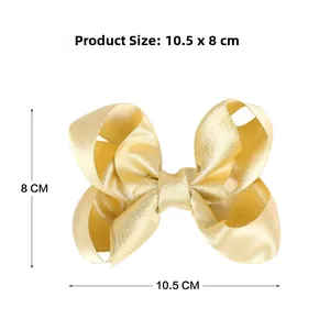 Detail der 10,5 cm goldenen Glitzer-Haarschleife mit genauen Größenangaben auf Weiß