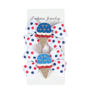Pair of US Independence Day hair bows with red blue dots and glittery ice cream cones