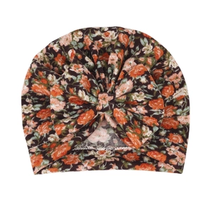 Close-up of floral baby turban beanie with large bow detail and soft cotton fabric