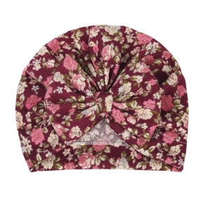 Floral baby turban hat in burgundy with a large bow detail made of soft elastic cotton