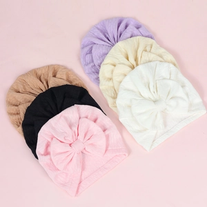 Set of six colorful elastic baby turbans with large bows in a soft waffle knit fabric