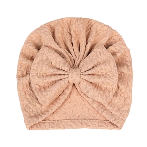 Peach pink stretch baby turban hat with textured waffle knit and large front bow