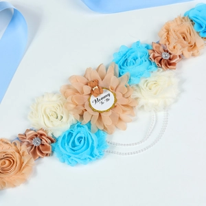 Baby Shower Mommy To Be sash with blue silk flowers, brown bear, and pearl chains