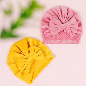 Newborn baby corduroy turban hats with large bows in soft pink and yellow colors
