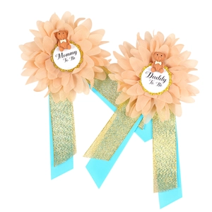 Mommy and Daddy To Be floral corsage set with blue ribbon and brown bear motif
