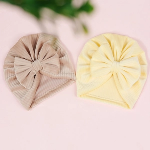 Soft ribbed baby turban hats with large bows in pastel yellow and coffee colors