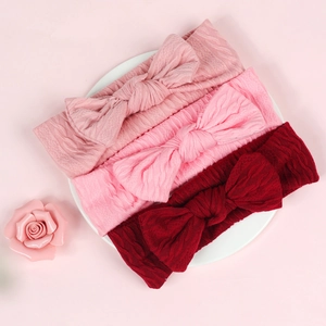 Détails du tricot de bandeaux pour bébés avec grands nœuds en rose et bordeaux foncé