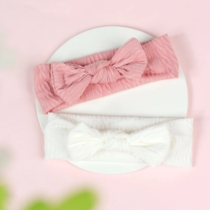 Lot de deux bandeaux élastiques pour bébé avec nœud en maille côtelée rose et blanc