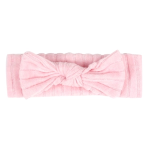 Close-up of baby stretchy headband featuring soft ribbed cotton fabric and knotted bow