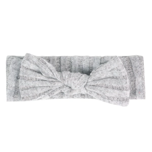 Detail of grey ribbed knit baby headband featuring a large soft bow and elastic fabric