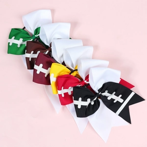 Detailed flat lay of colorful rugby patterned ribbon bow hair ties in six vibrant colors