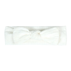 Detail of baby white knit headband with textured lace pattern and large bow knot