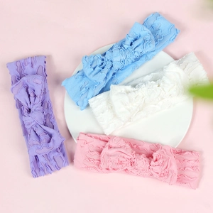 Elastic baby bow headbands in soft pastel colors including purple blue white and pink