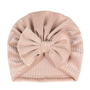 Close-up of baby turban hat showing soft ribbed texture and large bow detail
