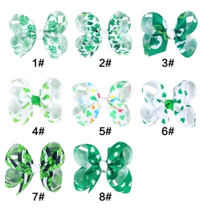 Détail de 8 styles de barrettes à nœud de 3 pouces pour la Saint-Patrick trèfle