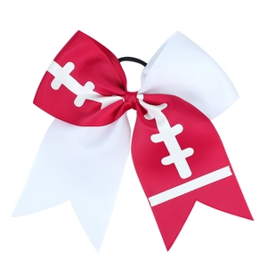 Detailed view of red and white American football patterned ribbon bow with elastic band