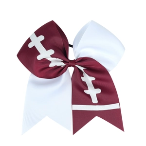 Detail of maroon and white grosgrain ribbon cheer bow with football stitch pattern