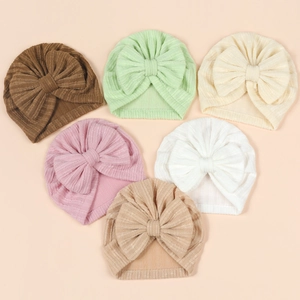 Vertical striped baby turban hats with large bows in six assorted neutral colors