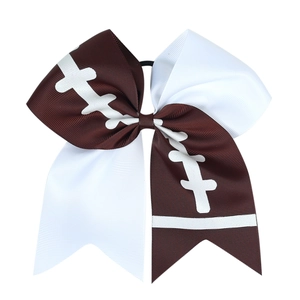 Macro shot of cheerleader bow hair tie with rugby patterns and elastic band