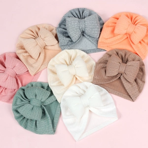 Soft waffle knit baby turbans with oversized bows in nine vibrant pastel colors