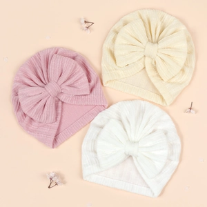 Baby turban hat set with large bow in pink, cream and white ribbed knit fabric