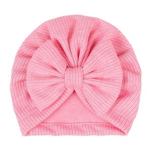 Pink striped baby turban hat featuring a soft knit fabric and large decorative bow detail