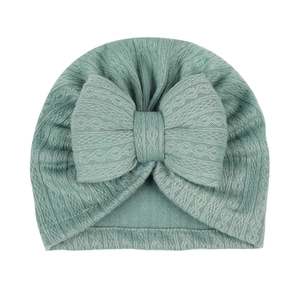 Newborn baby turban hat in mint green with large bow and textured knit pattern