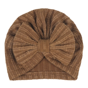 Detail of coffee brown ribbed knit baby turban hat with large decorative bow on front