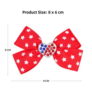 Close-up of patriotic red ribbon hair bow with white stars and rhinestone heart center
