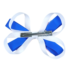 Detail of blue and white grosgrain ribbon layers on a metal duckbill hair clip