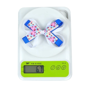 Detail view of American Flag themed double-layer bow hair clip weighing 6.7 grams