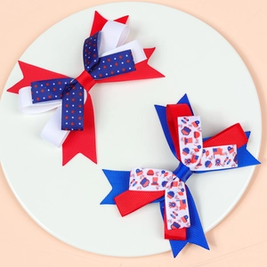 Independence Day hair bows for girls featuring American flag patterns and grosgrain ribbon
