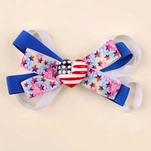 Handmade American flag themed layered hair bow clip with star patterns and heart center