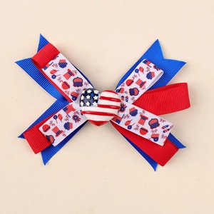 Close-up of Independence Day hair bow with red, white, and blue American flag motifs